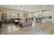Spacious living room showcasing an open floor plan with kitchen and a large sectional sofa at 42 S Nevada Way, Gilbert, AZ 85233