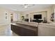 Comfortable living room featuring a fireplace, large TV, and neutral color palette at 42 S Nevada Way, Gilbert, AZ 85233