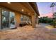 Spacious covered patio with comfortable seating and ample room for outdoor dining at 42 S Nevada Way, Gilbert, AZ 85233