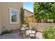 Cozy outdoor patio with seating and lush landscaping creates a peaceful retreat at 42 S Nevada Way, Gilbert, AZ 85233