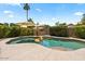 Relaxing pool area with an umbrella providing shade, perfect for outdoor enjoyment at 42 S Nevada Way, Gilbert, AZ 85233