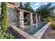 Community water feature showcasing a decorative stone fountain, lush landscaping, and tranquil setting at 42 S Nevada Way, Gilbert, AZ 85233