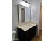 Bathroom featuring a single sink vanity, overhead lighting, and neutral color scheme at 421 S 113Th Way, Mesa, AZ 85208
