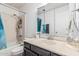 Standard bathroom featuring a single sink vanity, shower-tub combination, and neutral color scheme at 421 S 113Th Way, Mesa, AZ 85208