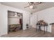 Bright bedroom featuring wood-look flooring and a storage closet at 421 S 113Th Way, Mesa, AZ 85208