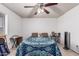 Bedroom featuring wood-look floors, ceiling fan, and ample space for various furniture arrangements at 421 S 113Th Way, Mesa, AZ 85208