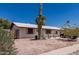 Charming single-story house with xeriscape front yard featuring a striking saguaro cactus at 421 S 113Th Way, Mesa, AZ 85208