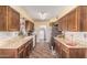 Spacious kitchen with ample countertops, wooden cabinets, and tile flooring at 421 S 113Th Way, Mesa, AZ 85208