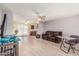 Open-concept living area with wood flooring and a view of the kitchen at 421 S 113Th Way, Mesa, AZ 85208