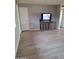 Spacious living room with a modern television, new flooring, and neutral paint at 421 S 113Th Way, Mesa, AZ 85208