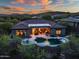 Aerial sunset view of home with desert landscaping, backyard pool and outdoor living at 42429 N Cross Timbers Ct, Anthem, AZ 85086
