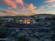 Wide aerial view of the property showcasing the backyard pool, landscaping, and distant views at 42429 N Cross Timbers Ct, Anthem, AZ 85086