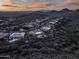 Picturesque aerial view of a desert neighborhood with luxurious homes and stunning mountain backdrop at 42429 N Cross Timbers Ct, Anthem, AZ 85086