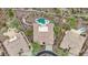 Expansive aerial view of a neighborhood with mature trees, desert landscape and private pools at 42429 N Cross Timbers Ct, Anthem, AZ 85086