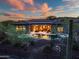 Home's open-concept living flows to a beautiful backyard with a pool, spa, and desert views at 42429 N Cross Timbers Ct, Anthem, AZ 85086