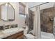 Bathroom featuring granite counter, dark cabinets, tub with tiled surround and shower curtain at 42429 N Cross Timbers Ct, Anthem, AZ 85086