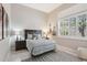 Bedroom showcasing tile floors, window with shutters, and guitars mounted as art at 42429 N Cross Timbers Ct, Anthem, AZ 85086