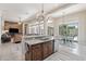 Charming kitchen featuring an island, stainless steel appliances, and an open-concept design at 42429 N Cross Timbers Ct, Anthem, AZ 85086