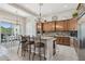 Charming kitchen showcasing a center island with bar stool seating and an adjacent dining area at 42429 N Cross Timbers Ct, Anthem, AZ 85086