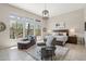 Bright main bedroom showcasing a comfortable seating area and scenic outdoor views at 42429 N Cross Timbers Ct, Anthem, AZ 85086