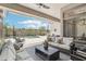 Relaxing outdoor patio with comfortable seating and desert views, creating a serene oasis at 42429 N Cross Timbers Ct, Anthem, AZ 85086