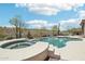 Inviting private pool and spa surrounded by desert landscape and mountain views at 42429 N Cross Timbers Ct, Anthem, AZ 85086