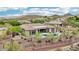 Single-story home featuring a pool, desert landscaping, and outdoor seating at 42429 N Cross Timbers Ct, Anthem, AZ 85086