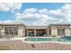 Beautiful rear exterior showcasing the pool, desert landscape and seating area at 42429 N Cross Timbers Ct, Anthem, AZ 85086