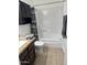 Well-lit bathroom featuring a tub with shower, granite vanity, and dark wood cabinet at 520 N Stapley Dr # 265, Mesa, AZ 85203