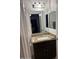 Granite vanity top with under-mount sink, framed mirror, and dark wood cabinetry at 520 N Stapley Dr # 265, Mesa, AZ 85203