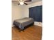 Bedroom with laminate flooring, ceiling fan, and neutral wall color at 520 N Stapley Dr # 265, Mesa, AZ 85203