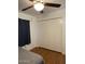 Bedroom with laminate flooring, ceiling fan, and a double door closet at 520 N Stapley Dr # 265, Mesa, AZ 85203