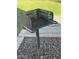 Outdoor grill on a metal post set on gravel with grass in the background at 520 N Stapley Dr # 265, Mesa, AZ 85203