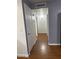 Hallway with laminate flooring and a neutral color palette at 520 N Stapley Dr # 265, Mesa, AZ 85203