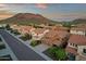 Scenic aerial view of the beautiful neighborhood, showcasing its well-maintained houses and mountain backdrop at 5223 W Bent Tree Dr, Phoenix, AZ 85083