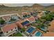 Aerial view highlighting the home's pool, solar panels and the community's serene landscape at 5223 W Bent Tree Dr, Phoenix, AZ 85083