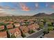 Aerial view of a residential neighborhood surrounded by scenic mountains and beautiful skies at 5223 W Bent Tree Dr, Phoenix, AZ 85083