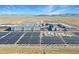 Expansive aerial view showcasing the scale of the industrial solar panel installation site at 5223 W Bent Tree Dr, Phoenix, AZ 85083