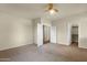 Bedroom featuring neutral walls and carpet flooring with views into the hall and closet at 5223 W Bent Tree Dr, Phoenix, AZ 85083