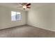 Neutral bedroom featuring carpeted floors, bright windows, and ceiling fan at 5223 W Bent Tree Dr, Phoenix, AZ 85083