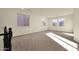 Upstairs bonus room with plush carpet, neutral walls and ample natural light from large windows at 5223 W Bent Tree Dr, Phoenix, AZ 85083