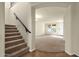Inviting foyer with staircase leading to the second floor and an archway to the main living area at 5223 W Bent Tree Dr, Phoenix, AZ 85083
