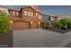 Charming two-story home featuring a three-car garage and beautiful stone accents with inviting landscape at 5223 W Bent Tree Dr, Phoenix, AZ 85083