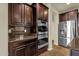 Modern kitchen showcasing stainless steel appliances, granite countertops, and dark wood cabinets at 5223 W Bent Tree Dr, Phoenix, AZ 85083