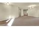 Bright living room with neutral walls, soft carpet, and a decorative chandelier at 5223 W Bent Tree Dr, Phoenix, AZ 85083