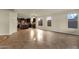 Open-concept living area with tile flooring, seamlessly flowing into the kitchen space at 5223 W Bent Tree Dr, Phoenix, AZ 85083