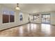 Spacious living room featuring tile floors, bright windows and glass sliding doors to outside pool at 5223 W Bent Tree Dr, Phoenix, AZ 85083