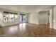 Spacious living area with tile flooring, large windows and sliding doors leading to the backyard at 5223 W Bent Tree Dr, Phoenix, AZ 85083