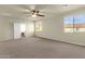 Main bedroom with carpet flooring, neutral walls, and ensuite access at 5223 W Bent Tree Dr, Phoenix, AZ 85083