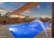 Stunning pool with water features, surrounded by a privacy fence and landscaped yard at 5223 W Bent Tree Dr, Phoenix, AZ 85083